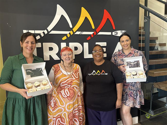 UQ and Triple A staff celebrating their partnership with morning tea.
