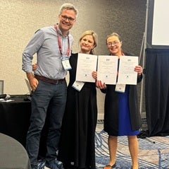 Rebecca Bednarek and Paula Jarzabkowski receiving the SAP Best Paper Award on Paul Spee’s behalf from SAP Program Chair Professor Martin Friesl.