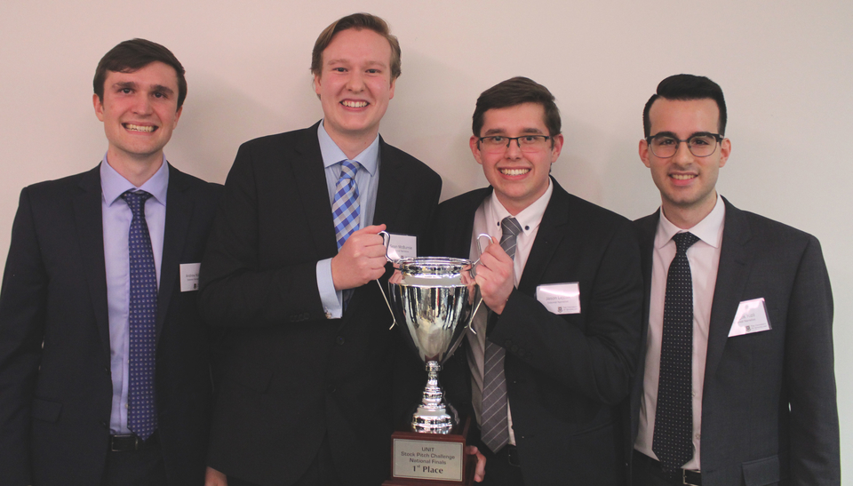 The winning team with their trophy 