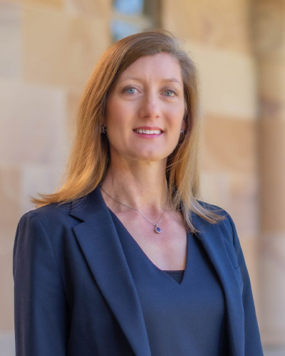 Profile photo of Professor Nicole Gillespie, standing in UQ's Great Court