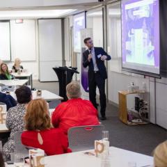 Dr Adam Kay presenting at a Business Chicks event
