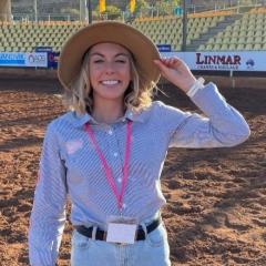Sally Bird standing at Mt Isa Rodeo 