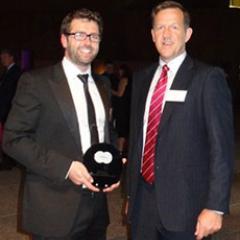Paul Newbury (right) receives his award in Sydney