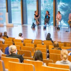 panel on stage in Advanced Engineering Building