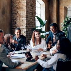 Group of professionals sit in a brick office