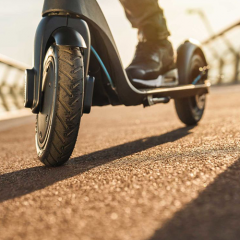 image of male on e-scooter