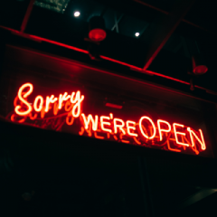 Neon sign saying 'Sorry we're open'