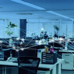 Office with a blue overtone, and a digital interconnected dots representing connections