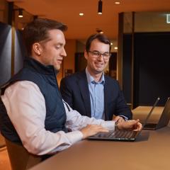 Mentor and student looking at computer