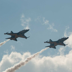 Planes flying with clouds in the sky 
