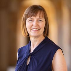 Headshot of Fiona Stroud standing in the Great Court