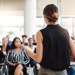 Person standing in front of a group presenting